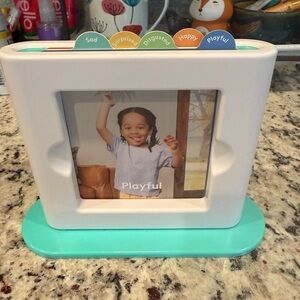 Interactive Emotion Learning Toy with White and Teal Base